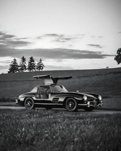 Black and white poster of Mercedes-Benz 300SL Gullwing with iconic upward-opening doors, fine art automotive print by Montclair Collective