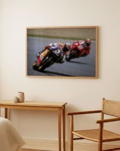 Vintage motorcycle racing poster of 1990s rider leaning into apex