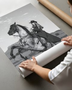 Black and white portrait of a cowgirl riding a horse