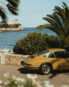 Vintage Porsche 911 full-color photography poster featuring the iconic sports car in stunning detail. Perfect wall art for car enthusiasts and modern spaces.