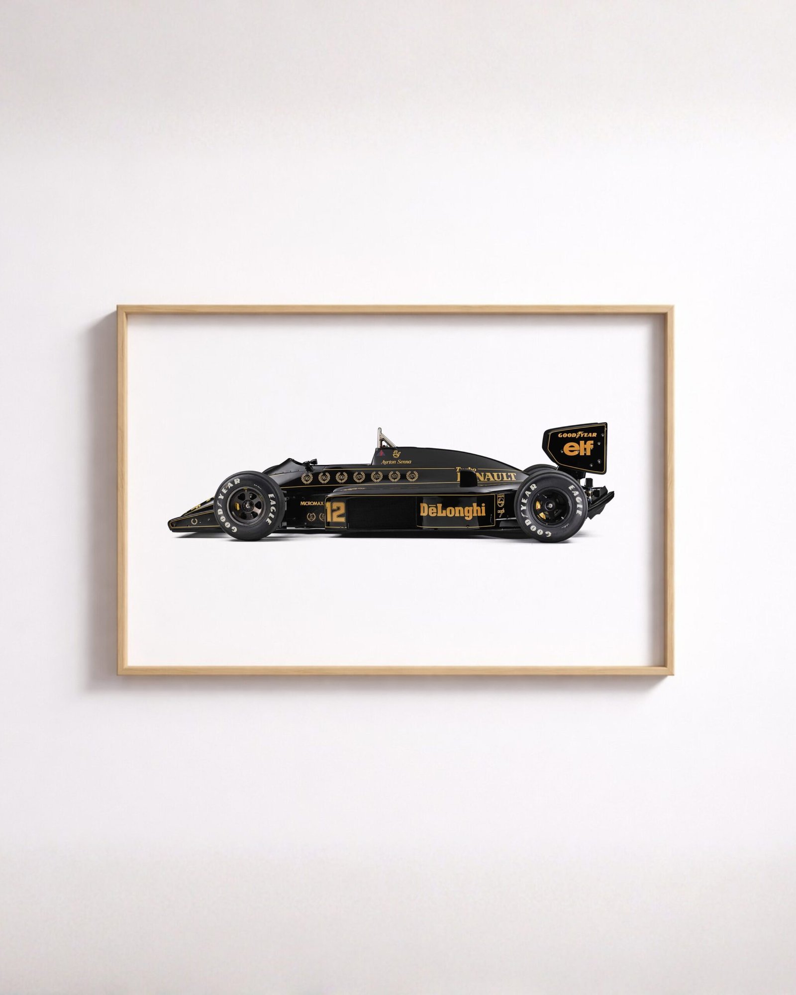 Framed side-profile illustration of a black and gold Formula 1 car with sponsor decals, number 12.