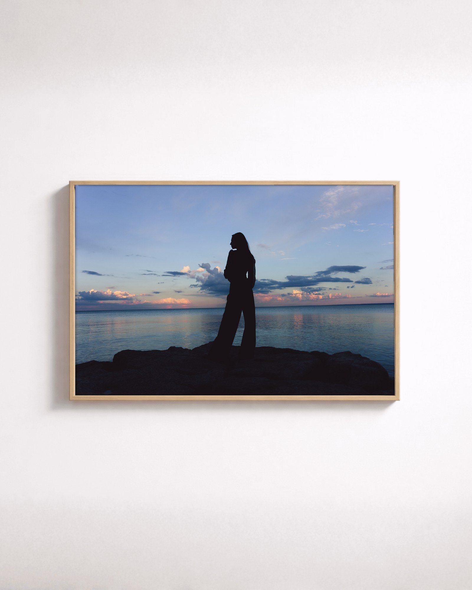 Shoreline by Shazard R., shown framed in natural oak on a white wall
